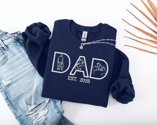 Navy blue sweatshirt with 'DAD EST. 2025' embroidery filled with family photos