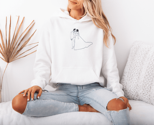 model wearing a personalized hoodie with a stitched outline of a couple